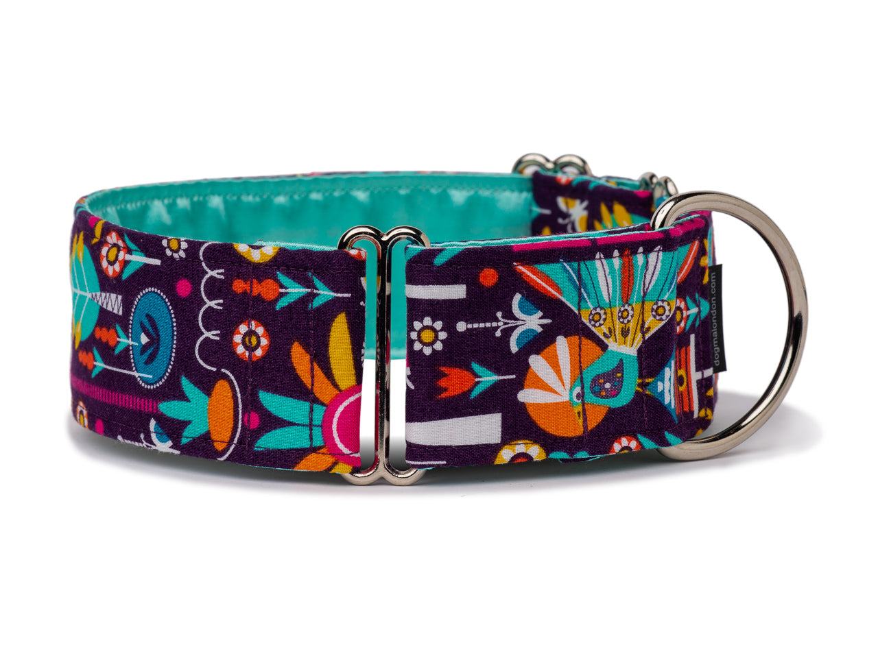 Vibrant, stylized flowers and peacocks parade on a dark purple path. Perfect for the pup with a flamboyant personality!