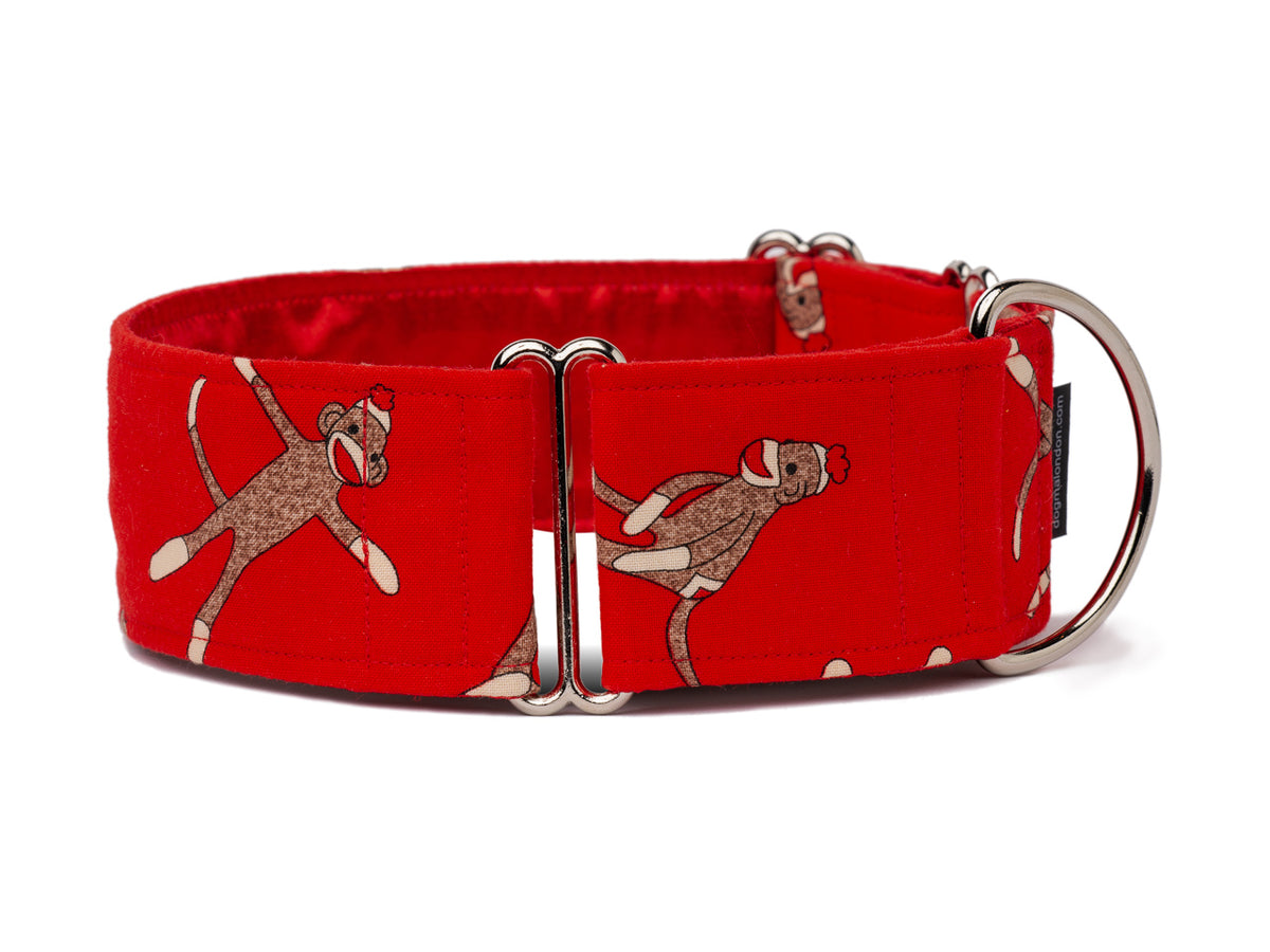 These cute sock monkeys on rich red are sure to please any playful pooch!